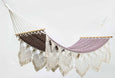 Handwoven pomegranate hammock with teak bar and fringe