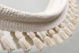 Close-up of artisan knotting and soft cotton weave on bar-free boho hammock
