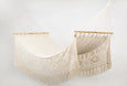 Artisan-crafted cotton hammock featuring customizable name embroidery