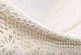 Luxury boho hammock in natural cotton, shown suspended without a wooden bar
