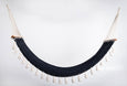 Handwoven black cotton hammock with solid teak bar and hand-tied tassels