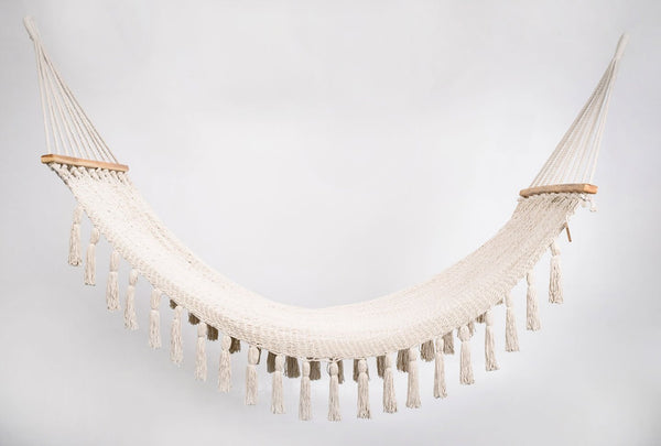Handwoven natural cotton hammock with teak bar and hand-tied tassels