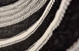 Close-up of natural wooden spreader bar with hand-tied knots and triple-weave cotton threads in black and natural hues, showcasing artisanal detail.