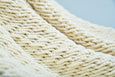 Close-up of macramé craftsmanship on luxury earth-tone cotton hammock