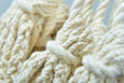 Close-up of macramé craftsmanship on luxury earth-tone cotton hammock