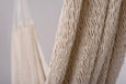 Close-up of handcrafted cotton hammock in neutral tones