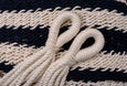Close-up of a navy cotton hammock with natural drape design